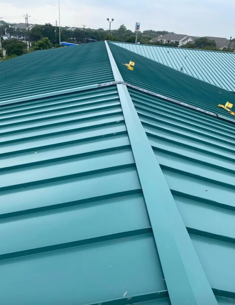 Green commercial metal roof ridge and valley for Metal Roof Repair in La Crescent
